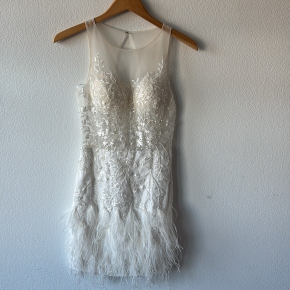 Jovani Scoop neck flower embellished bodice with mesh and a feathered Miniskirt. - Picture 4 of 10